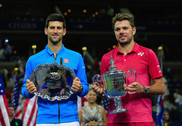 Djokovic and Wawrinka holding their respective trophies following the conclusion of the US Open final (Photo by Chris Trotman / Getty Images)