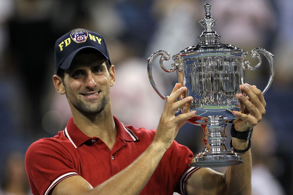 Djokovic holding his first US Open title and third Grand Slam singles title in 2011 (Photo by Matthew Stockman / Getty Images)