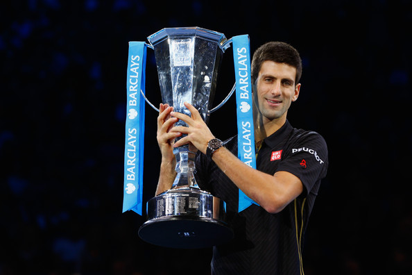 Djokovic holding the ATP World Tour Finals trophy in 2014 (Photo by Julian Finney / Getty Images)