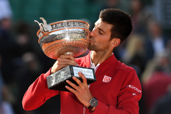 Djokovic kissing the Coupe des Mosquitaires for the first time in his career (Photo by Dennis Grombkowski / Getty Images)