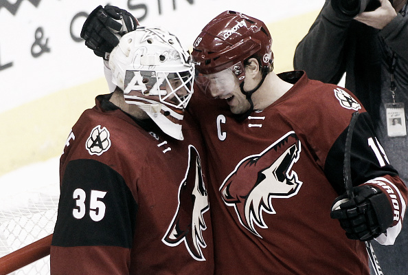  Goaltender Louis Domingue #35 and Shane Doan #19 of the Arizona Coyotes celebrate after a 5-1 victory against the Florida Panthers at Gila River Arena on March 5, 2016 in Glendale, Arizona. (Photo by Ralph Freso/Getty Images)