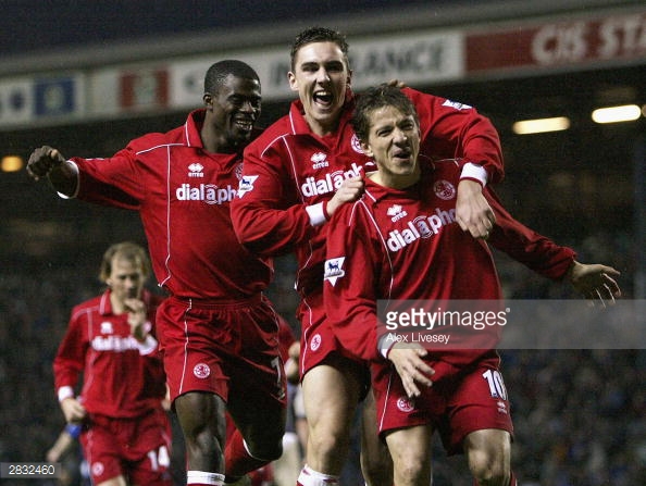 A fresh faced Downing (centre) celebrates with club legend Juninho during the club's cup winning season | Photo: Getty