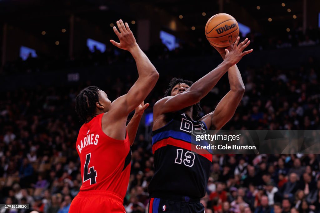 James Wiseman #13 of the Detroit Pistons puts up a shot over Scottie Barnes #4 of the Toronto Raptors during the second half of the game at Scotiabank Arena on November 19, 2023 in Toronto, Canada. NOTE TO USER: User expressly acknowledges and agrees that, by downloading and or using this photograph, User is consenting to the terms and conditions of the Getty Images License Agreement. (Photo by Cole Burston/Getty Images)