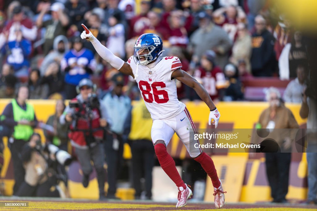 Darius Slayton #86 of the New York Giants celebrates after scoring a touchdown during an NFL football game between the Washington Commanders and the New York Giants at FedExField on November 19, 2023 in Landover, Maryland. (Photo by Michael Owens/Getty Images)