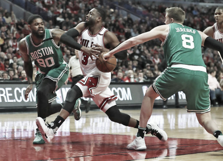 Dwyane Wade fighting through the Celtics defense  |  Getty Images