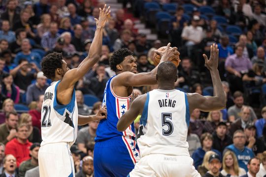 Joel Embiid (middle) gets double teamed in the post. PHOTO: Brace Hemmelgarn/USA Today Sports