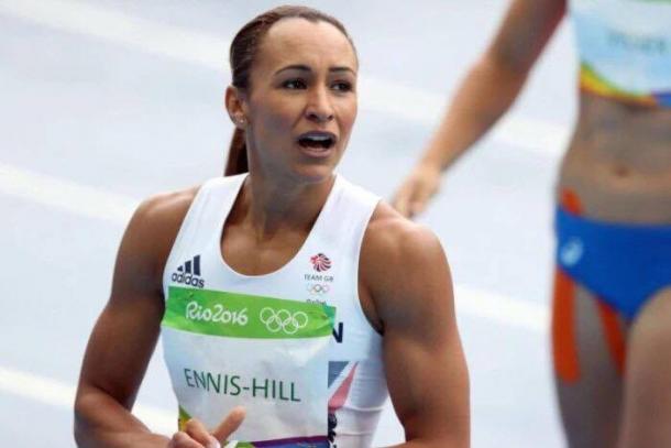 Ennis-Hill glances to coach Toni Minichiello after her hurdle victory. | Source: BBC