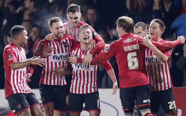 Exeter players celebrate their first goal (photo: getty)