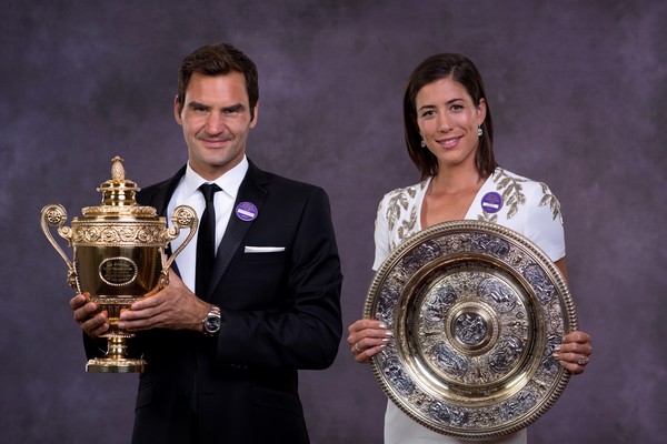 Federer (left) pictured with Muguruza (right) were on stage together for the Champions Dinner (Source: Pool / Getty)