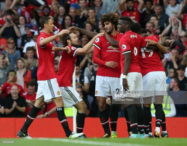 Manchester United, here celebrating Marouane Fellaini's goal against Leicester City, are off to a flying start.