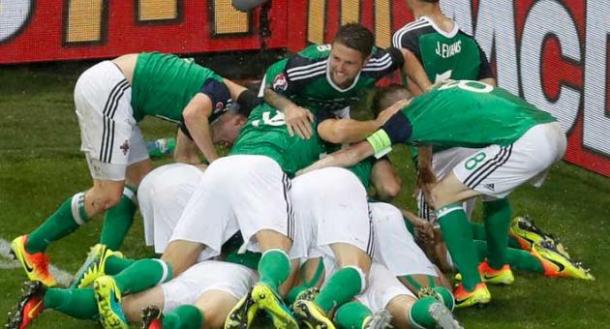 The Northern Ireland players celebrate McAuley's opener against Ukraine | Photo: Getty