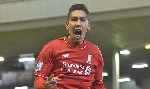 Firmino celebrates one of his two goals against Arsenal (photo: getty)