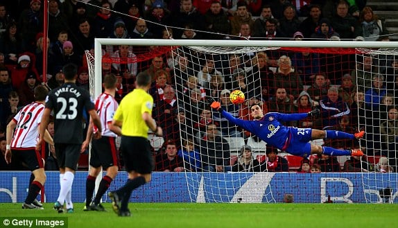 Mannone stretches to tip Firmino's effort onto the post (photo: Getty Images)