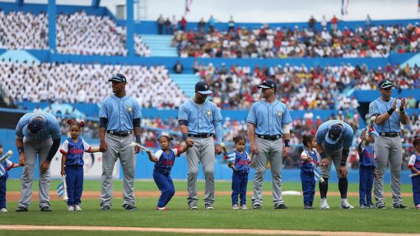 Rays players stand with children as they are introduced before the start of their game against the Cuban national team on March 22, 2016, in Havana, Cuba. (Joe Raedle / Getty Images)