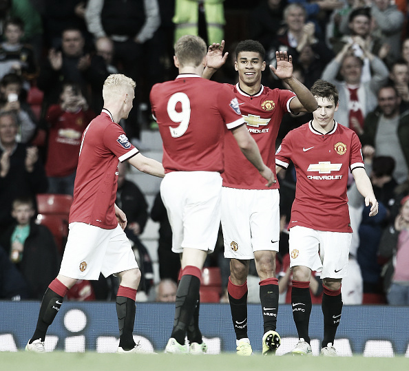 Fletcher (second right) celebrates during a youth team match at Old Trafford | Photo: Matthew Peters/ Manchester United