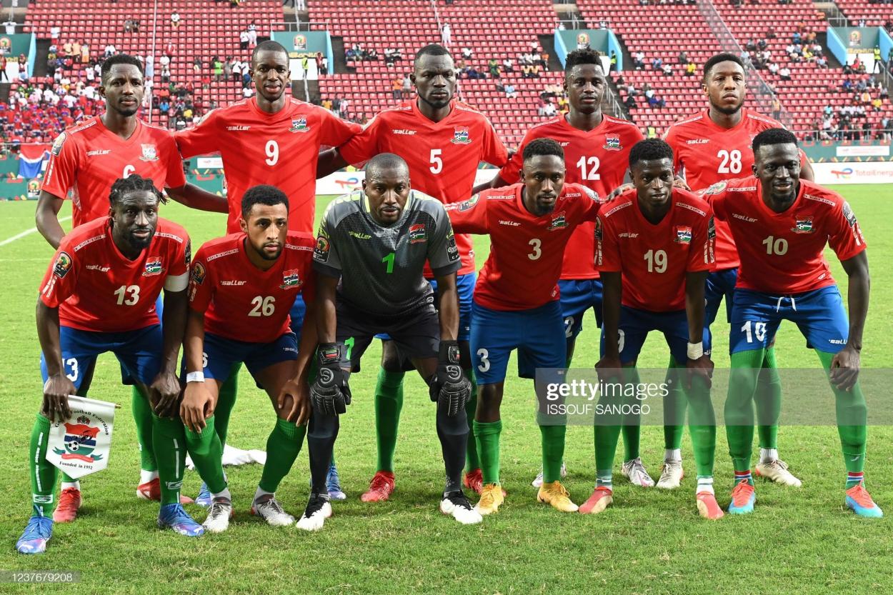 (FromL) Back row: Gambia's players, midfielder Sulayman Marreh, forward Assan Ceesay, defender Omar Colley defender James Gomez, midfielder Ebou Adams; Front row: defender Pa Modou Jagne, defender Ibou Touray, goalkeeper Modou Jobe, midfielder Ablie Jallow, forward Ebrima Colley and midfielder Musa Barrow pose before the Group F Africa Cup of Nations (CAN) 2021 football match between Mauritania and Gambia at Limbe Omnisport Stadium in Limbe on January 12, 2022. (Photo by Issouf SANOGO / AFP) (Photo by ISSOUF SANOGO/AFP via Getty Images)