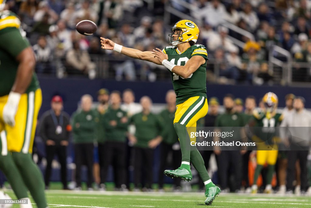 Jordan Love #10 of the Green Bay Packers throws a pass on the run during an NFL wild-card playoff football game between the Dallas Cowboys and the Green Bay Packers at AT&T Stadium on January 14, 2024 in Arlington, Texas. (Photo by Michael Owens/Getty Images)