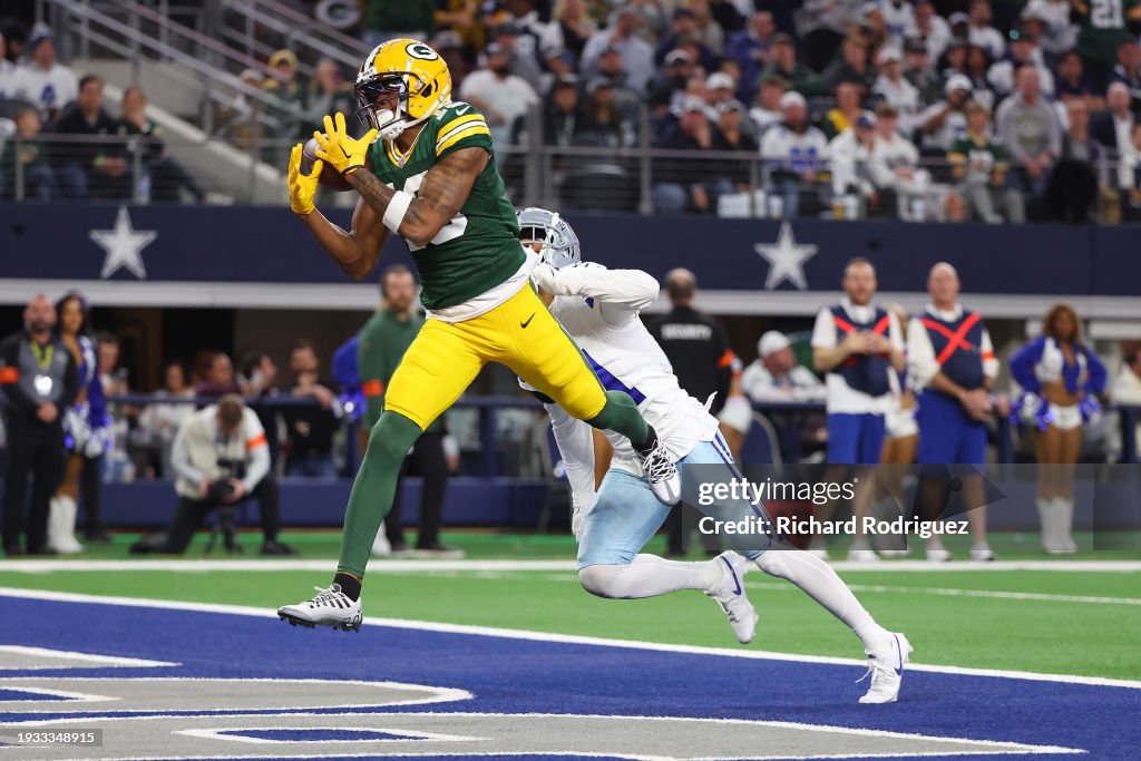 Dontayvion Wicks #13 of the Green Bay Packers catches a pass for a touchdown in front of Stephon Gilmore #21 of the Dallas Cowboys during the second quarter of the NFC Wild Card Playoff game at AT&T Stadium on January 14, 2024 in Arlington, Texas. (Photo by Richard Rodriguez/Getty Images)