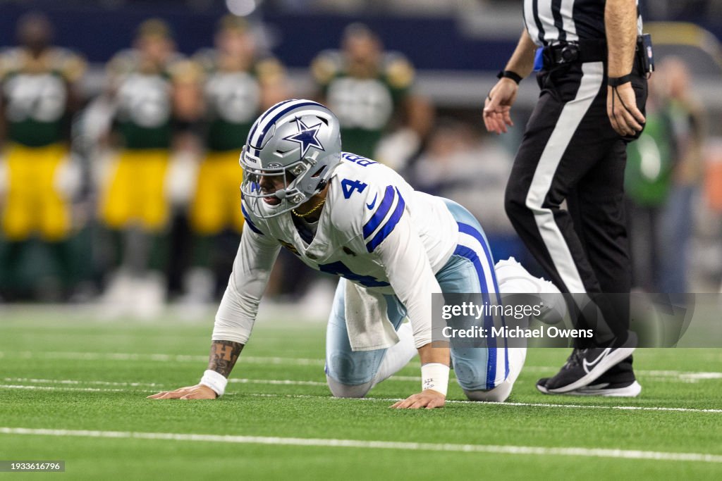Dak Prescott #4 of the Dallas Cowboys reacts during an NFL wild-card playoff football game between the Dallas Cowboys and the Green Bay Packers at AT&T Stadium on January 14, 2024 in Arlington, Texas. (Photo by Michael Owens/Getty Images)
