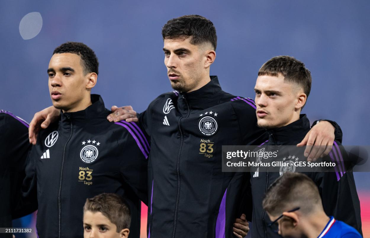 Jamal Musiala, Kai Havertz and Florian Wirtz of Germany look on prior to the international friendly match between France and Germany at Groupama Stadium on March 23, 2024 in Lyon, France. (Photo by Markus Gilliar - GES Sportfoto/Getty Images)
