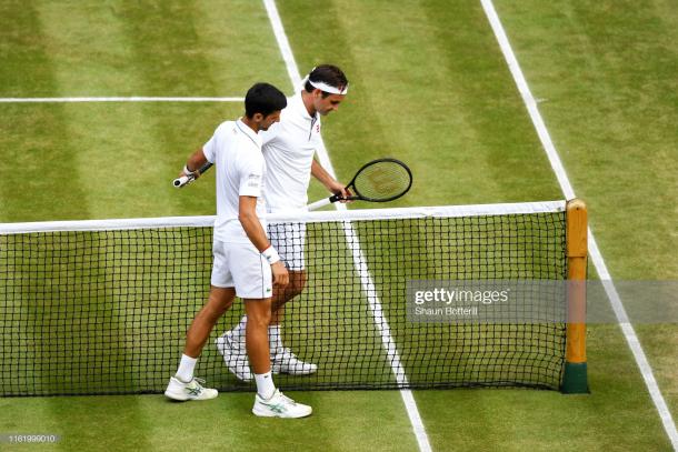 The two great champions embrace at the net (Image source: Shaun Botterill/Getty Images)