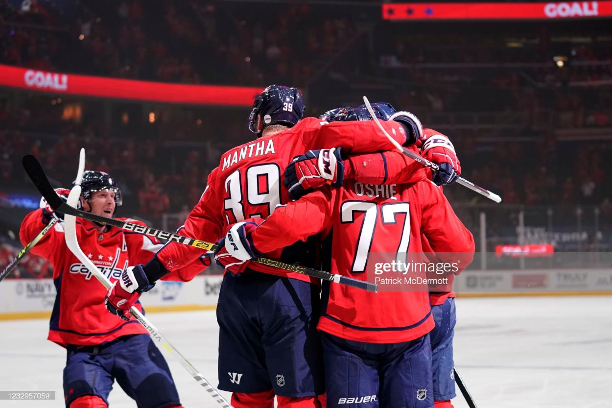 T.J. Oshie celebrates with teammates after scoring Washington's first goal in Game 2/Photo: Patrick McDermott/Getty Images