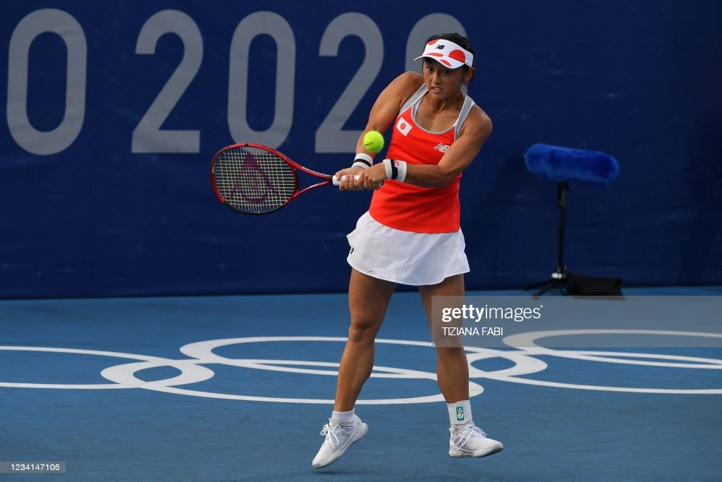 Doi hits a backhand during her first=round victory/Photo: Tiziana Fabi/AFP via Getty Images