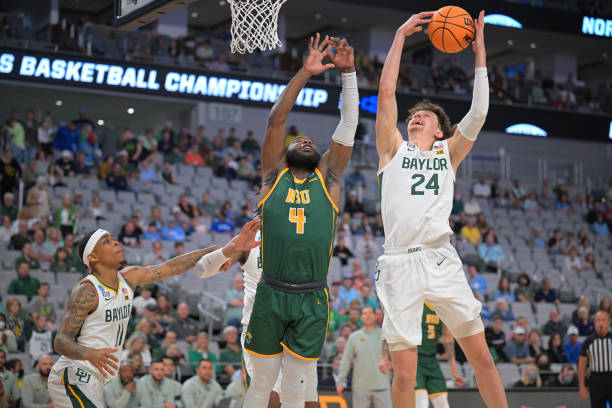 Matthew Mayer of Baylor grabs a rebound over Joe Bryant Jr. of <strong><a  data-cke-saved-href='https://www.vavel.com/en-us/ncaa/2021/03/16/college-basketball/1063739-mid-eastern-athletic-conference-championship-game-norfolk-state-defeats-morgan-state-to-reach-ncaa-tournament.html' href='https://www.vavel.com/en-us/ncaa/2021/03/16/college-basketball/1063739-mid-eastern-athletic-conference-championship-game-norfolk-state-defeats-morgan-state-to-reach-ncaa-tournament.html'>Norfolk State</a></strong> during their first-round <strong><a  data-cke-saved-href='https://www.vavel.com/en-us/ncaa/2022/03/15/college-basketball/1105200-2022-southland-conference-championship-game-texas-am-corpus-christi-rallies-past-southeastern-louisiana-for-ncaa-tournament-bid.html' href='https://www.vavel.com/en-us/ncaa/2022/03/15/college-basketball/1105200-2022-southland-conference-championship-game-texas-am-corpus-christi-rallies-past-southeastern-louisiana-for-ncaa-tournament-bid.html'>NCAA Tournament</a></strong> game/Photo: Andy Hancock/NCAA Photos via Getty Images