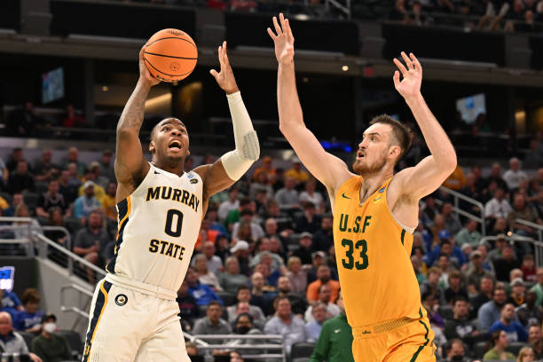 K.J. Williams of Murray State shoots over Volodymyr Markovetskyy of San Francisco during the teams' first-round NCAA Tournament game/Photo: Jamie Sabau/NCAA Photos via Getty Images