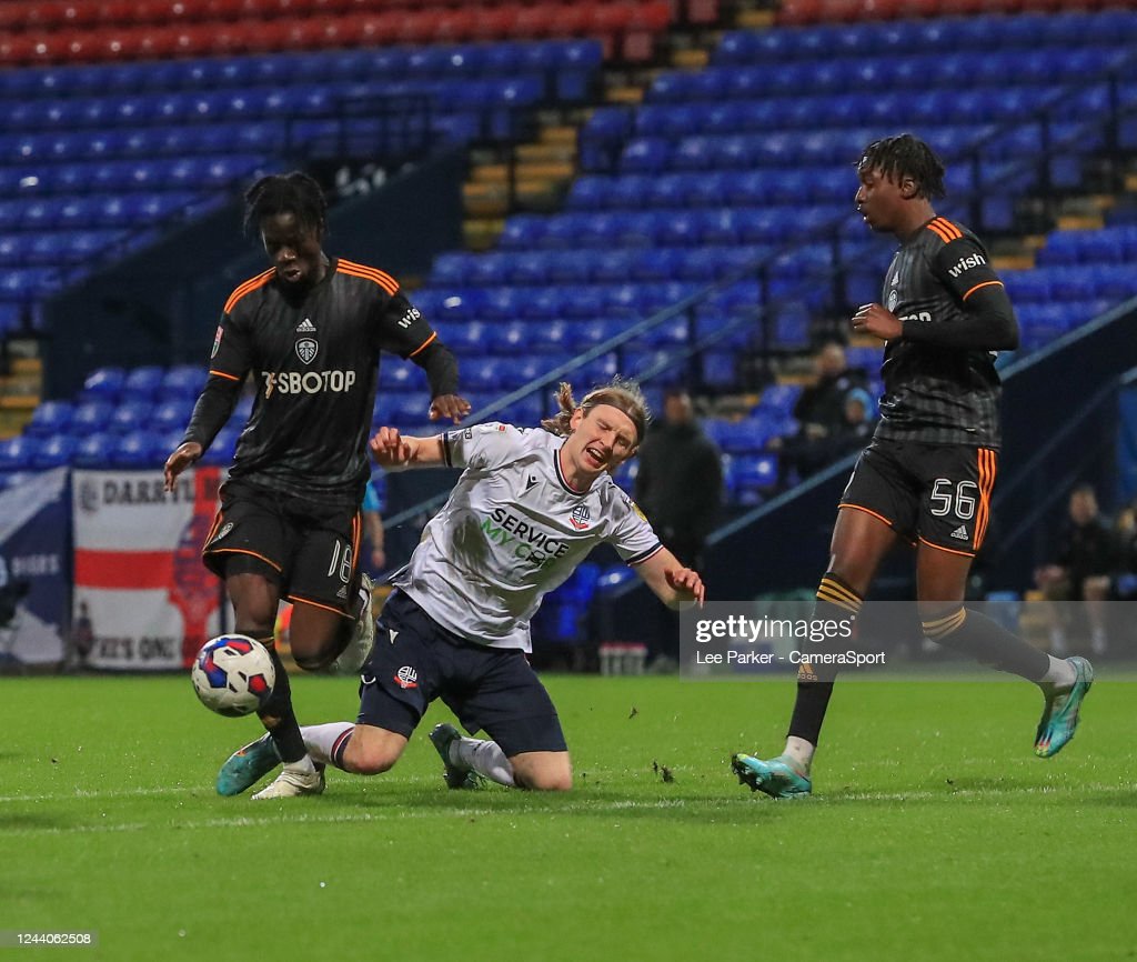 BOLTON, ENGLAND - OCTOBER 18: Bolton Wanderers' Jon Dadi Bodvarsson is tackled by Leeds United U21 Darko Gyabi during the Papa Johns Trophy Group B match between Bolton Wanderers and Leeds United U21 at University of Bolton Stadium on October 18, 2022 in Bolton, England. (Photo by Lee Parker - CameraSport via Getty Images)