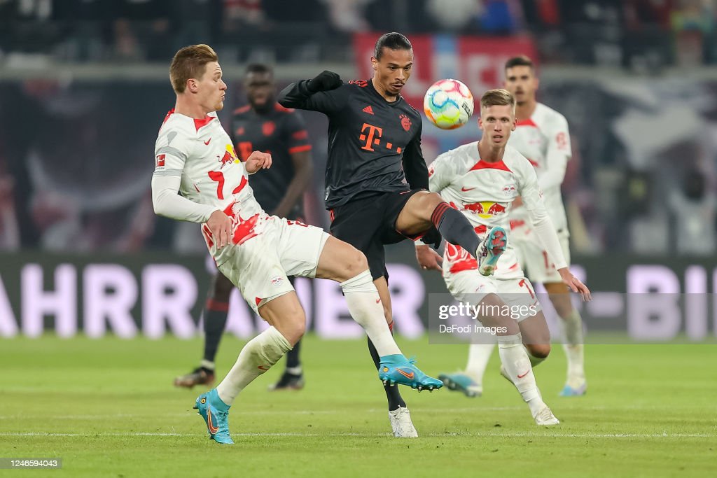 Halstenber battles for the ball with Leroy Sane - 