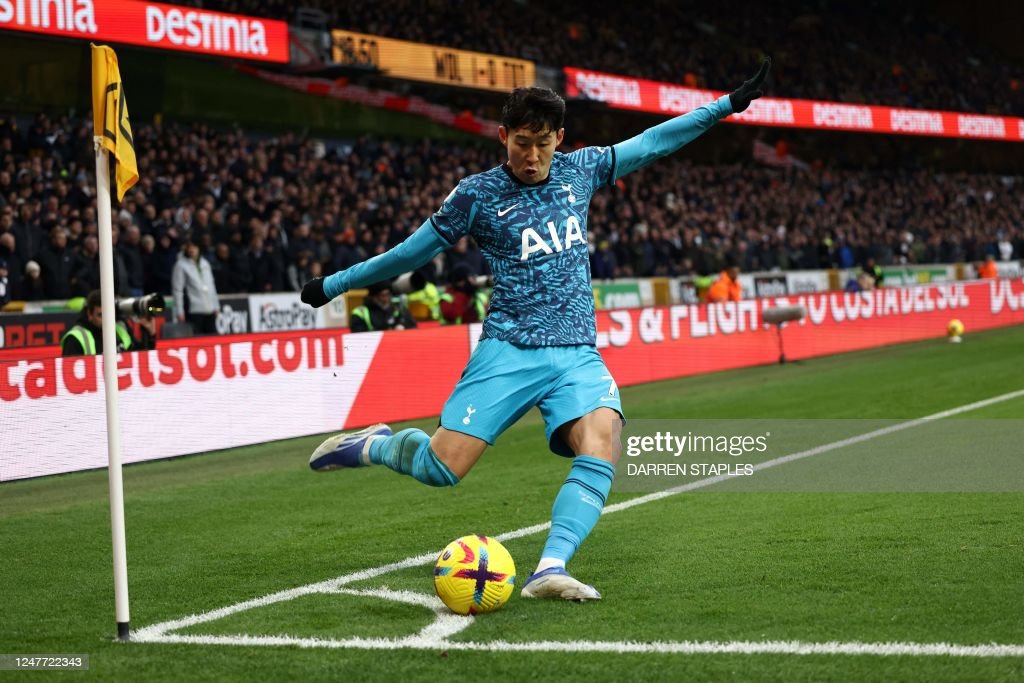 Heung-Min Son whips in a corner. (Photo by DARREN STAPLES/AFP via Getty Images)