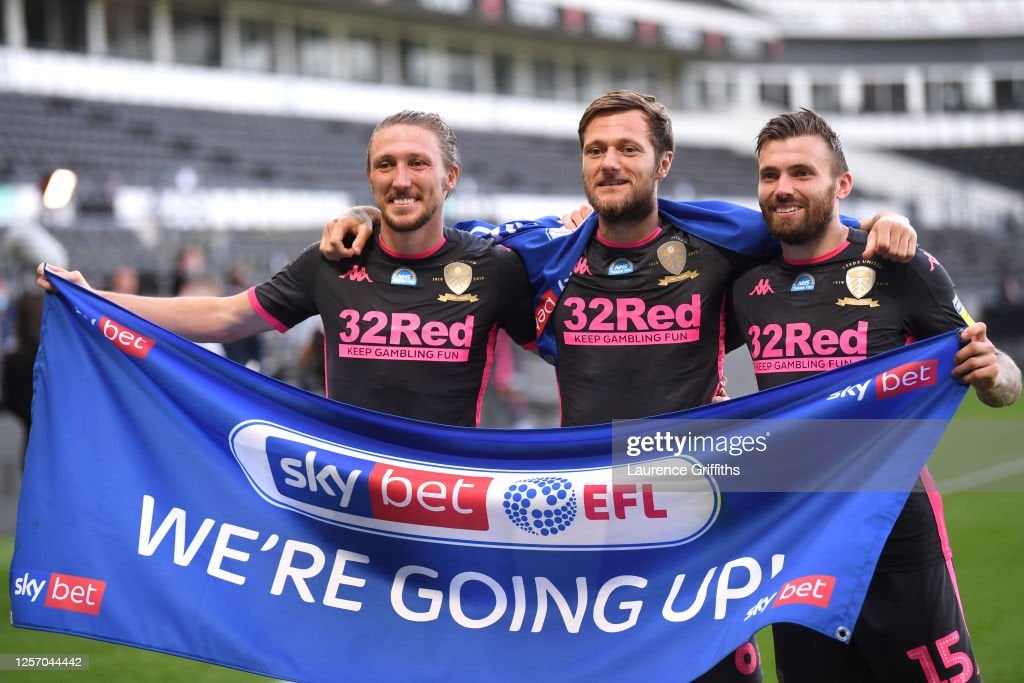 DERBY, ENGLAND - JULY 19: Luke Ayling of <strong><a  data-cke-saved-href='https://www.vavel.com/en/football/2023/05/21/premier-league/1147366-west-ham-3-1-leeds-rice-inspires-hammers-to-dominant-victory.html' href='https://www.vavel.com/en/football/2023/05/21/premier-league/1147366-west-ham-3-1-leeds-rice-inspires-hammers-to-dominant-victory.html'>Leeds United</a></strong> , Stuart Dallas of <strong><a  data-cke-saved-href='https://www.vavel.com/en/football/2023/05/21/premier-league/1147366-west-ham-3-1-leeds-rice-inspires-hammers-to-dominant-victory.html' href='https://www.vavel.com/en/football/2023/05/21/premier-league/1147366-west-ham-3-1-leeds-rice-inspires-hammers-to-dominant-victory.html'>Leeds United</a></strong> and Liam Cooper of <strong><a  data-cke-saved-href='https://www.vavel.com/en/football/2023/05/21/premier-league/1147366-west-ham-3-1-leeds-rice-inspires-hammers-to-dominant-victory.html' href='https://www.vavel.com/en/football/2023/05/21/premier-league/1147366-west-ham-3-1-leeds-rice-inspires-hammers-to-dominant-victory.html'>Leeds United</a></strong> celebrate after the Sky Bet Championship match between Derby County and <strong><a  data-cke-saved-href='https://www.vavel.com/en/football/2023/05/19/premier-league/1147100-sam-allardyce-says-its-do-or-die-time-for-his-players-ahead-of-their-game-against-west-ham.html' href='https://www.vavel.com/en/football/2023/05/19/premier-league/1147100-sam-allardyce-says-its-do-or-die-time-for-his-players-ahead-of-their-game-against-west-ham.html'>Leeds United</a></strong> at Pride Park Stadium on July 19, 2020 in Derby, England. Football Stadiums around Europe remain empty due to the Coronavirus Pandemic as Government social distancing laws prohibit fans inside venues resulting in all fixtures being played behind closed doors. (Photo by Laurence Griffiths/Getty Images)