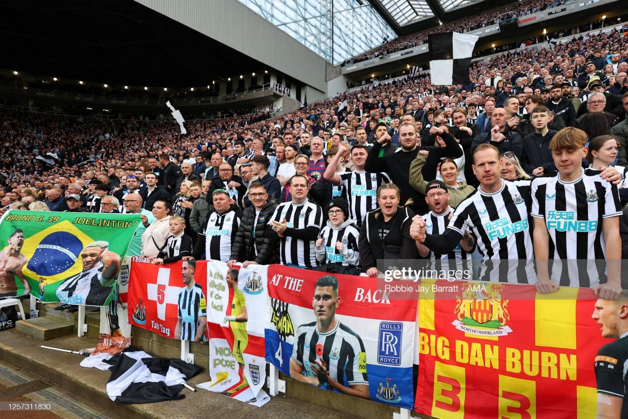 Fans of Newcastle United with their flags during the Premier League match between Newcastle United and Leicester City at St. James Park.. (Photo by Robbie Jay Barratt - AMA/Getty Images)