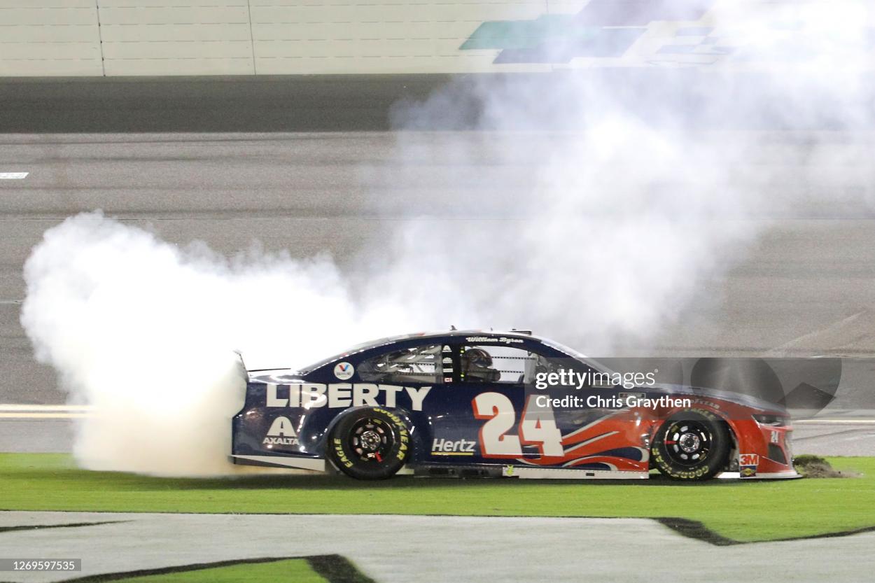 DAYTONA BEACH, FLORIDA - AUGUST 29: William Byron, driver of the #24 Liberty University Chevrolet, celebrates with a burnout after winning the NASCAR Cup Series Coke Zero Sugar 400 at Daytona International Speedway on August 29, 2020 in Daytona Beach, Florida. (Photo by Chris Graythen/Getty Images)
