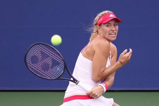 Kerber plays a shot against Friedsam/Photo: Matthew Stockman/Getty Images 