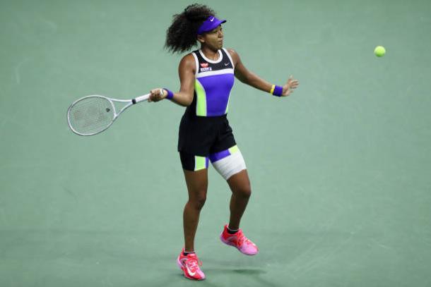 Osaka hits a forehand in her quarterfinal victory/Photo: Matthew Stockman/Getty Images