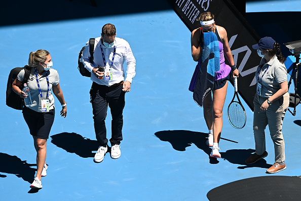 Azarenka walks off the court to receive a medical timeout (Quinn Rooney/Getty Images)