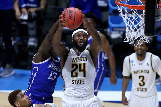 Wichita State's Morris Udeze grabs a rebound over Drake's Issa Samake during their First Four game/Photo: Justin Casterline/Getty Images