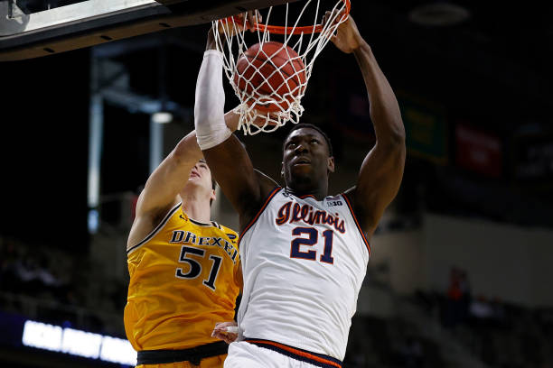 Illinois' Kofi Cockburn dunks over Drexel's James Butler during their first-round NCAA Tournament game/Photo: Maddie Meyer/Getty Images