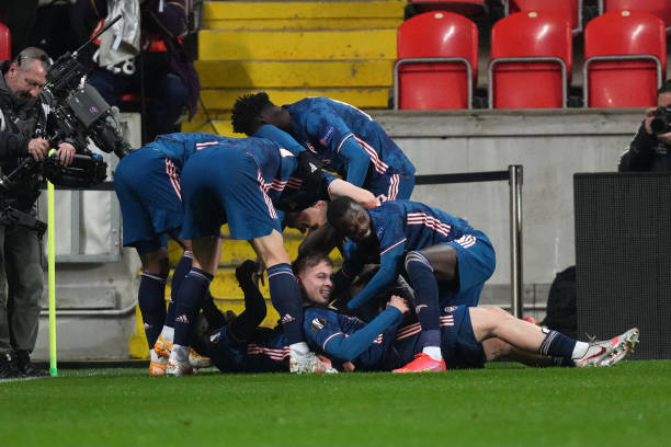 Saka is mobbed by his teammates after his great goal Photo by Martin Sidorjak viaGetty Images