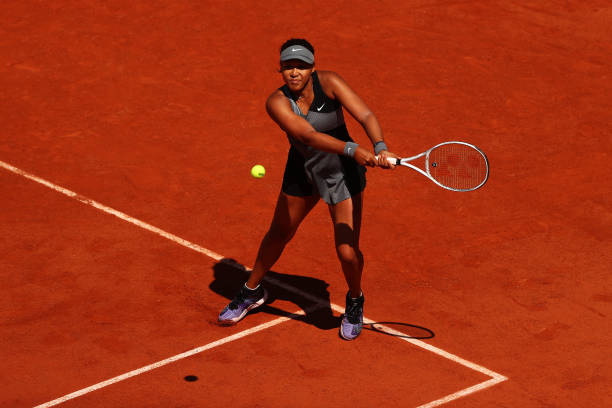 Osaka plays a backhand during her first-round victory/Photo: Julian Finney/Getty Images