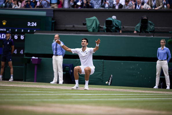 Djokovic celebrates his win at Wimbledon (Simon Bruty/Getty Images)