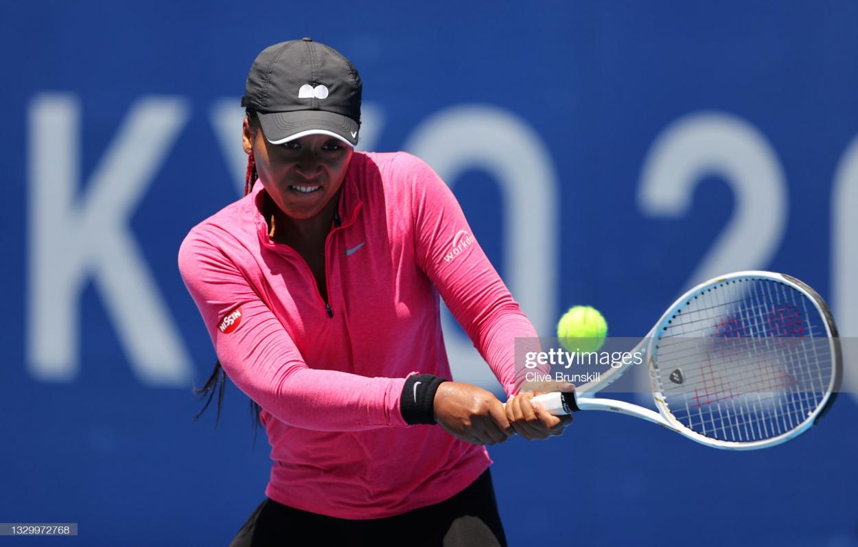 Osaka plays a backhand in practice in preparation for the Olympics/Photo: Clive Brunskill/Getty Images