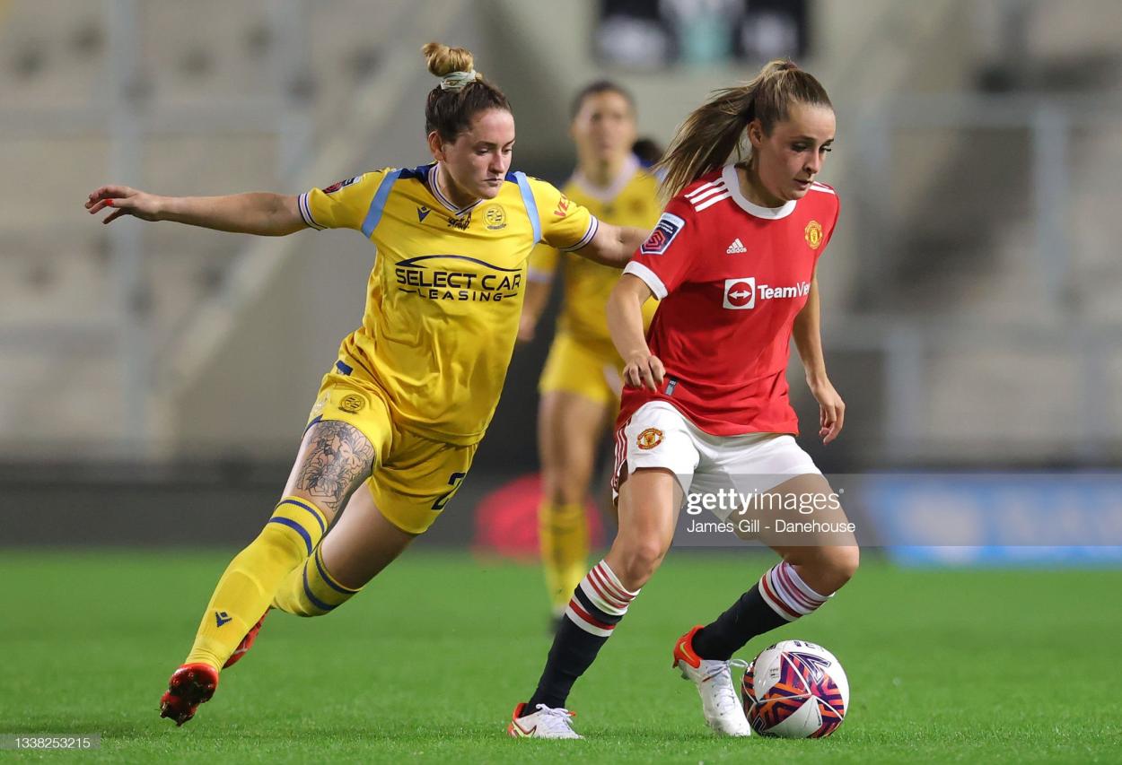 LEIGH, ENGLAND - SEPTEMBER 03: Ella Toone of <strong><a  data-cke-saved-href='https://www.vavel.com/en/football/2023/01/14/premier-league/1134602-manchester-united-2-1-manchester-city-ten-hags-side-dampen-citys-title-hopes.html' href='https://www.vavel.com/en/football/2023/01/14/premier-league/1134602-manchester-united-2-1-manchester-city-ten-hags-side-dampen-citys-title-hopes.html'>Manchester United</a></strong> Women turns from <strong><a  data-cke-saved-href='https://www.vavel.com/en/football/2021/01/23/womens-football/1056263-aston-villa-women-2-2-reading-another-relegation-battle-twist.html' href='https://www.vavel.com/en/football/2021/01/23/womens-football/1056263-aston-villa-women-2-2-reading-another-relegation-battle-twist.html'>Rachel Rowe</a></strong> of Reading Women during the Barclays FA Women's Super League match between <strong><a  data-cke-saved-href='https://www.vavel.com/en/football/2023/01/14/premier-league/1134602-manchester-united-2-1-manchester-city-ten-hags-side-dampen-citys-title-hopes.html' href='https://www.vavel.com/en/football/2023/01/14/premier-league/1134602-manchester-united-2-1-manchester-city-ten-hags-side-dampen-citys-title-hopes.html'>Manchester United</a></strong> Women and Reading Women at Leigh Sports Village on September 03, 2021 in Leigh, England. (Photo by James Gill - Danehouse/Getty Images)