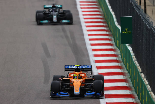  Lando Norris of Great Britain driving the (4) McLaren F1 Team MCL35M Mercedes leads Lewis Hamilton of Great Britain driving the (44) Mercedes AMG Petronas F1 Team Mercedes W12 during the F1 Grand Prix of Russia at Sochi Autodrom on September 26, 2021 in Sochi, Russia. (Photo by Bryn Lennon/Getty Images)