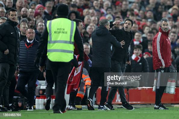 Mikel Arteta, Manager of Arsenal gestures to Juergen Klopp, Manager of Liverpool during the Premier League match between Liverpool and Arsenal at Anfield on November 20, 2021 in Liverpool, England. (Photo by Clive Brunskill/Getty Images)