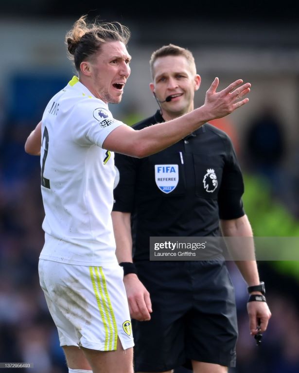 LEEDS, ENGLAND - FEBRUARY 26: Luke Ayling of Leeds United protests to referee Craig Pawson during the Premier League match between Leeds United and Tottenham Hotspur at Elland Road on February 26, 2022 in Leeds, England. (Photo by Laurence Griffiths/Getty Images)
