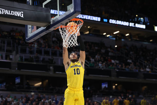 Frankie Collins goes up for a dunk as Michigan rallied past Colorado State/Photo: Dylan Buell/Getty Images