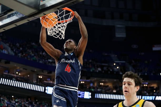 Nathan Cayo goes up for a dunk during Richmond's first-round win over Iowa/Photo: Joshua Bessex/Getty Images